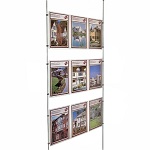 Triple A4P poster holders on wires as estate agent window display